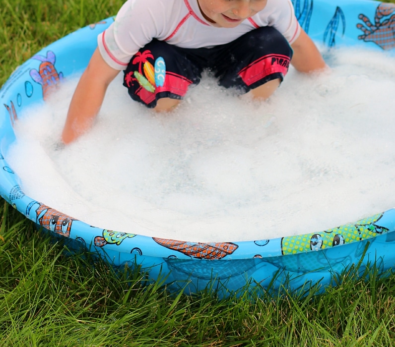 Let kids make giant bubbles outside this summer - so much fun, and so easy to set up!