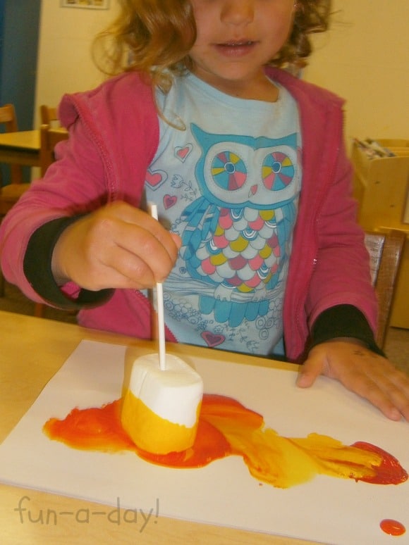 Having fun painting with marshmallows