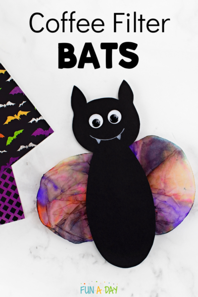 a black construction paper bat body glued onto wings made from a colored coffee filter and the text coffee filter bats in a pinnable size