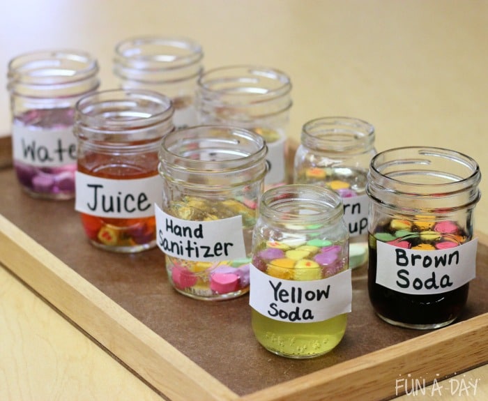Labeled jars with liquids and conversation hearts 