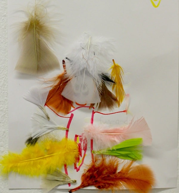 bird craft for kids - a lot of feathers decorate this bird!