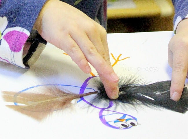 bird craft for kids - adding the feathers