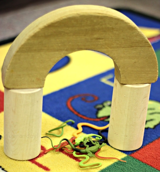 using blocks to build pet houses during a pet small world play activity