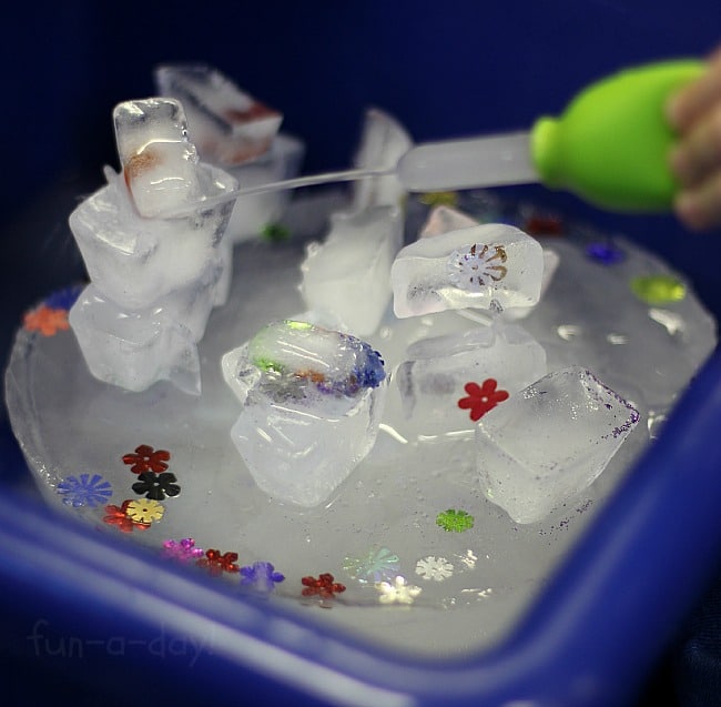 Trying to melt the ice castle in a preschool science experiment