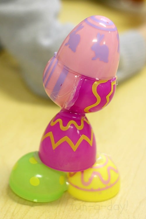 child-made Easter art project with plastic eggs in preschool