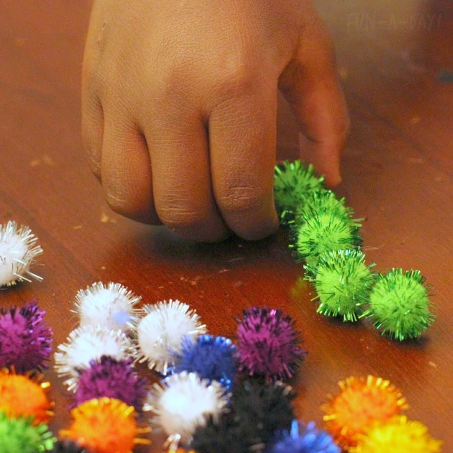 firework math activity - sorting pompoms by color