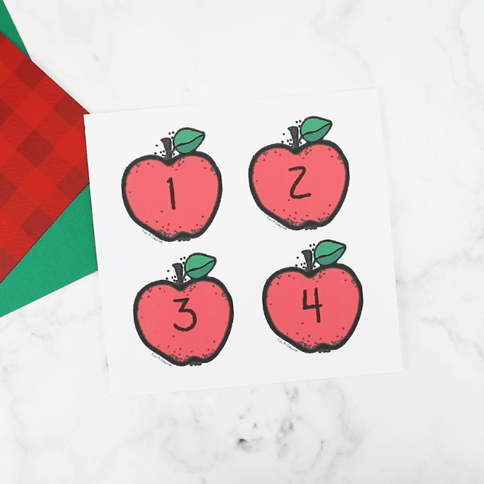 picture of four printable apple number cards on a page