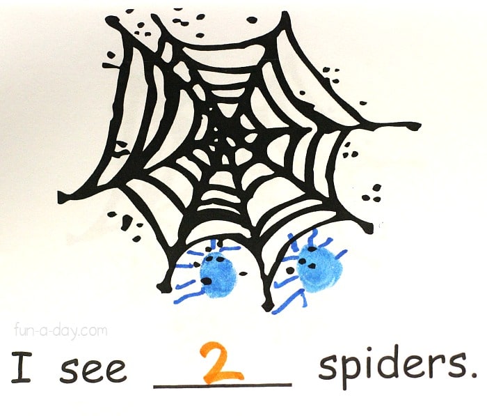 page from a preschool spider homemade book with text that reads I see 2 spiders.