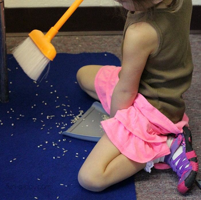 Cleaning up after the story of the little red hen sensory bin