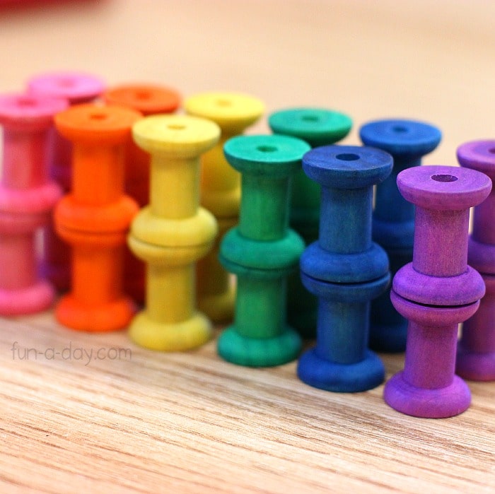 make fine motor skills activities even more fun with dyed wooden spools