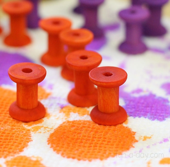 use dyed wooden spools in a variety of fine motor skills activities for children