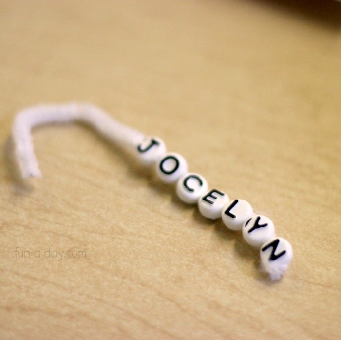 beaded pipe cleaner candy cane ornament with letter beads spelling out the name Jocelyn