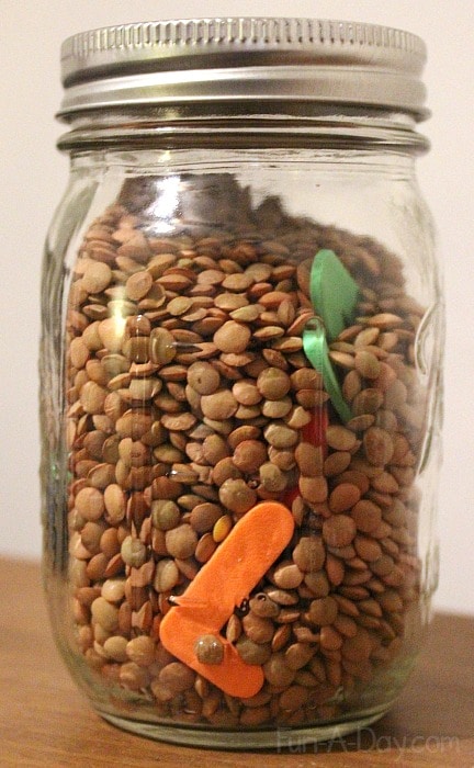 Make a preschool alphabet game using lentils or peas in a discovery jar. Perfect as a companion for the book LMNO Peas