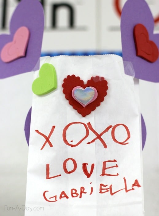Valentine craft for kids to make their parents - a festively decorated bag of treats