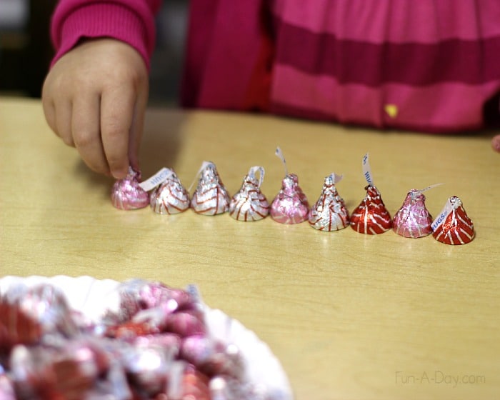 Valentine craft for kids to make their parents - counting chocolates to add to the gift