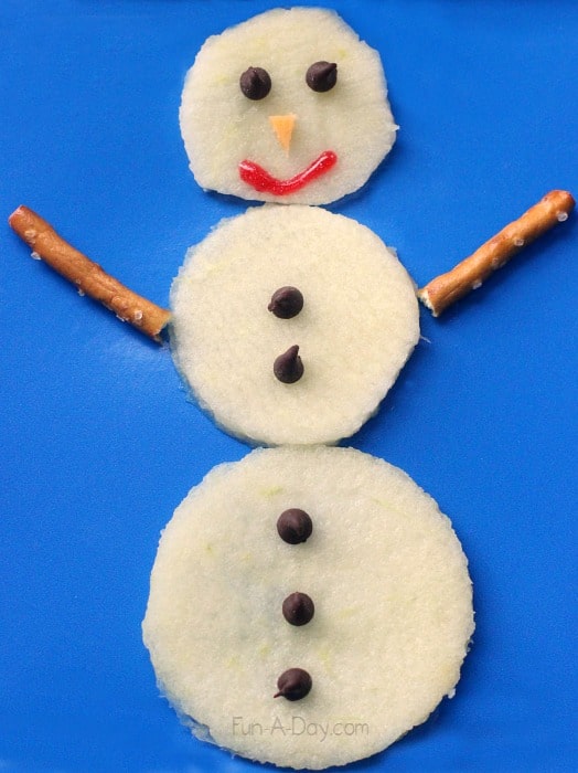 a snowman snack for preschool made of apple slices