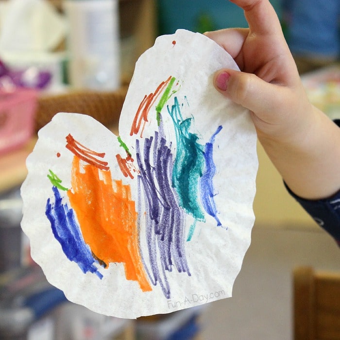 Fun valentine art project for preschoolers - making heart prints with coffee filters, markers, and water!