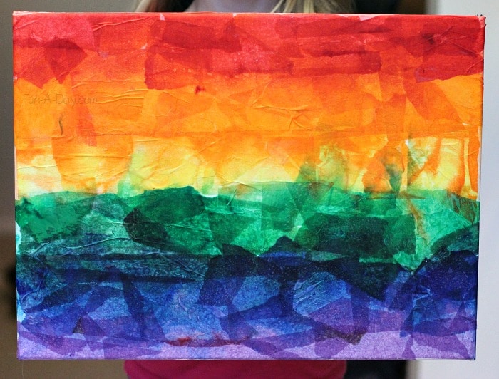 Gorgeous rainbow art for kids to make with tissue paper puzzle pieces