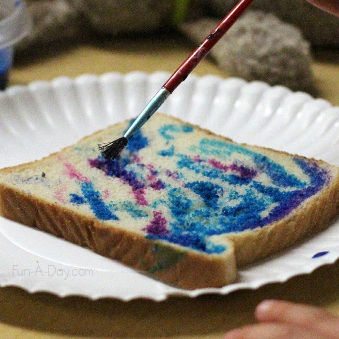 Painting toast as part of a fun Pajama Day activity and snack