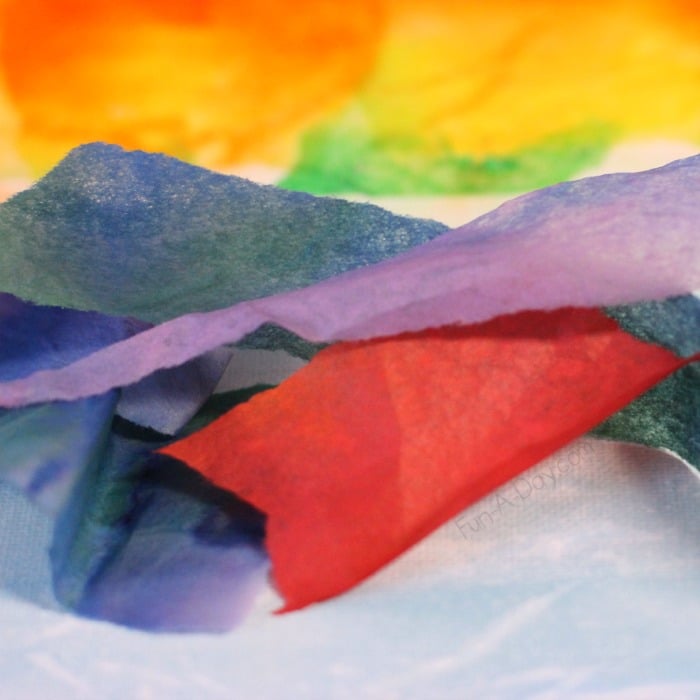 Using scraps of tissue paper to create beautiful rainbow art