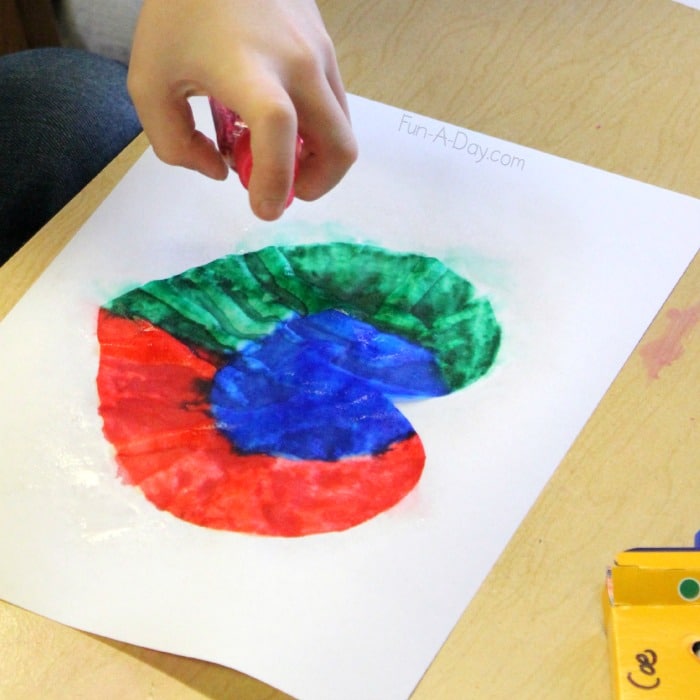 Valentine art project for preschoolers - Making colorful heart prints using coffee filters, markers, and water