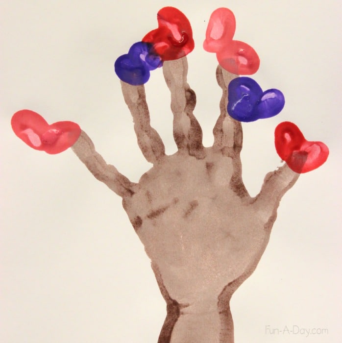 Valentine hand print craft for kids to make in February - a keepsake fingerprint heart tree