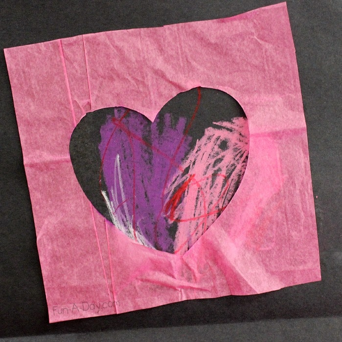 Valentine's Day craft using tissue paper, oil pastels, and black construction paper