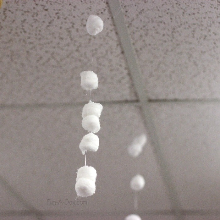 Building activities for preschoolers - set up an invitation to build ice castles, complete with falling snow hanging from the ceiling!