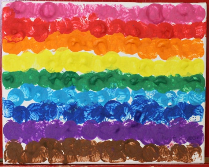 preschool collaborative rainbow dot art on a canvas