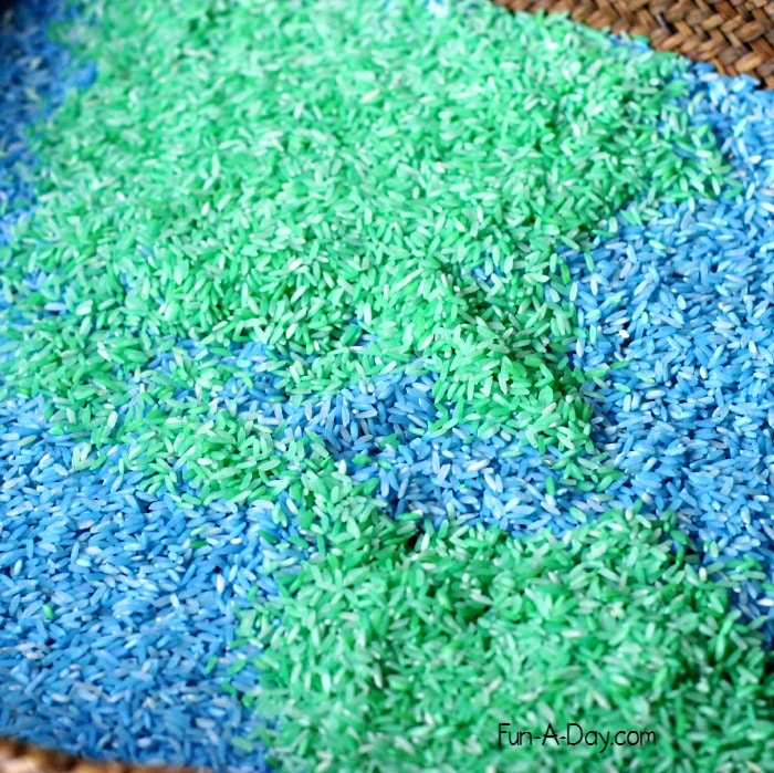 A colorful base for an Earth Day math sensory bin that works on preschool math concepts