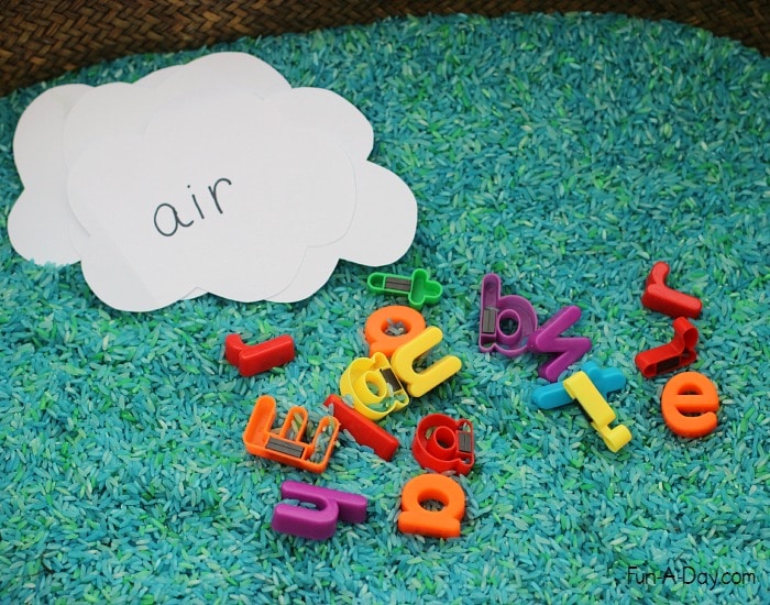 Preschool Earth Day sensory bin with letters to make words