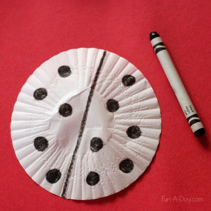 Working on a cupcake liner ladybug craft - lots of fun and learning with something very simple