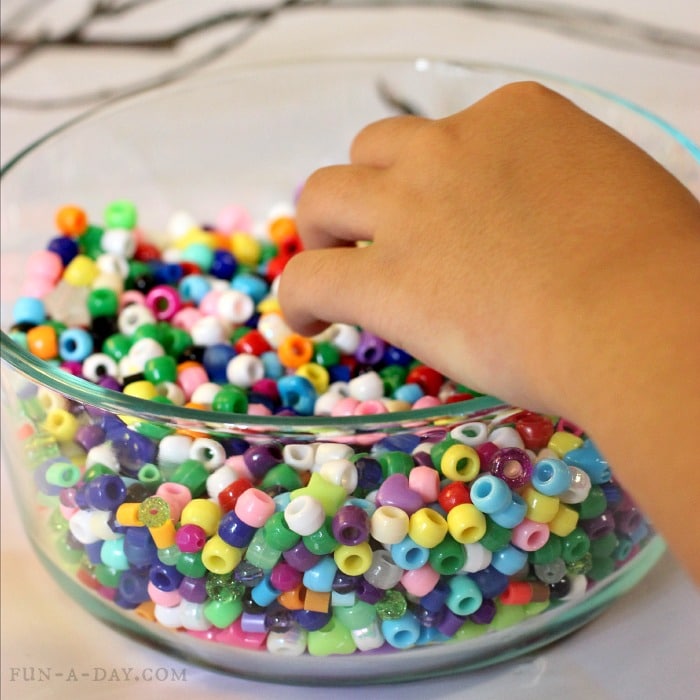 Easy nature crafts for kids - beaded sticks! What a great idea for a rainy day