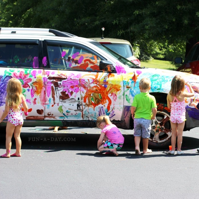 Working together on a summer art project - painting a car