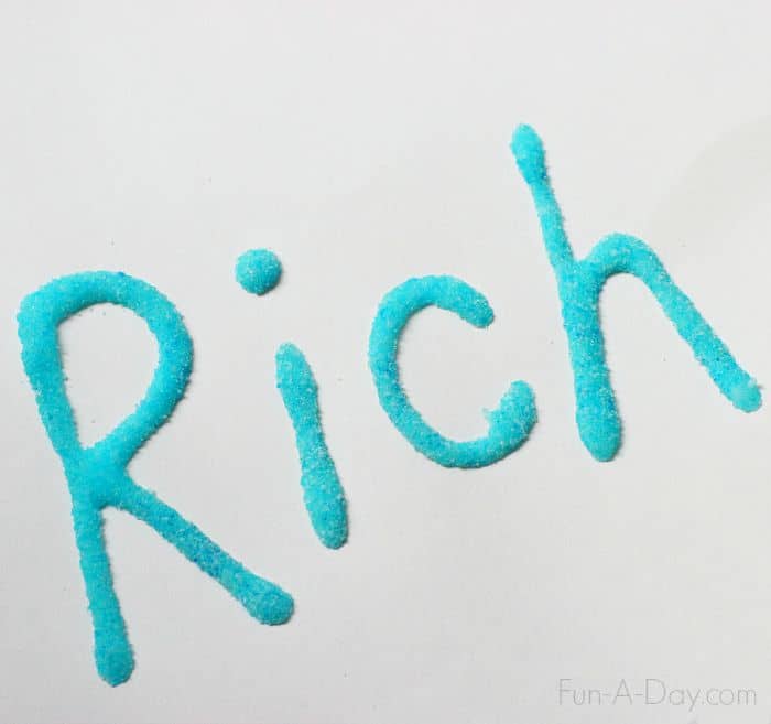 the name 'Rich' written in glue and covered with blue jell-o powder