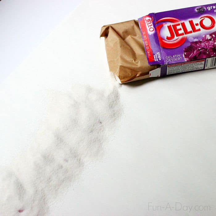 purple jell-o powder sprinkled over a name written in glue to make scratch and sniff name art