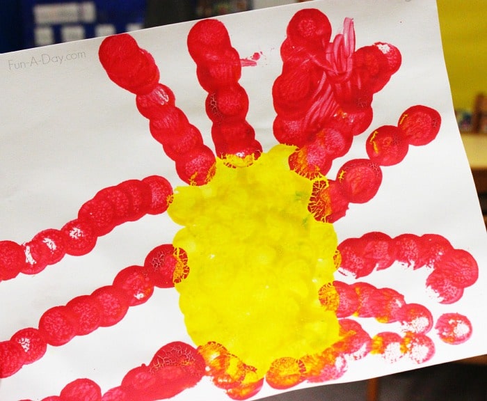 preschool child's dot art painting of the sun