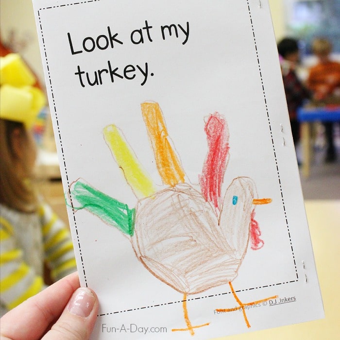 Final page of the Thanksgiving emergent reader that reads, 'Look at my turkey.' With child-drawn hand turkey.