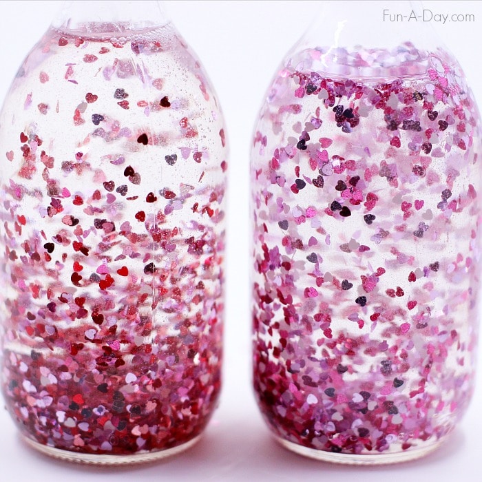 Two heart glitter jars to add to your valentine activities for preschoolers