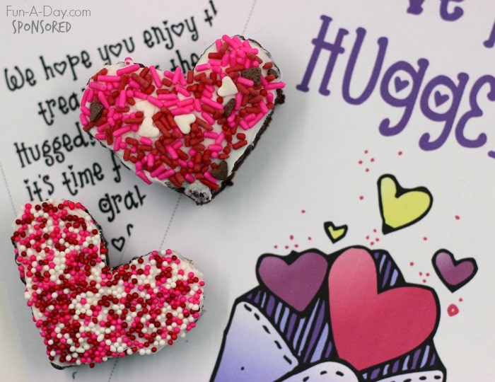 two decorated heart-shaped brownies on top of a you've been hugged printable