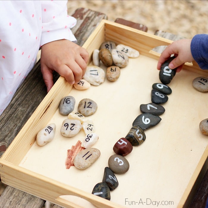 Simple number rocks can be taken outside for fun preschool number activities