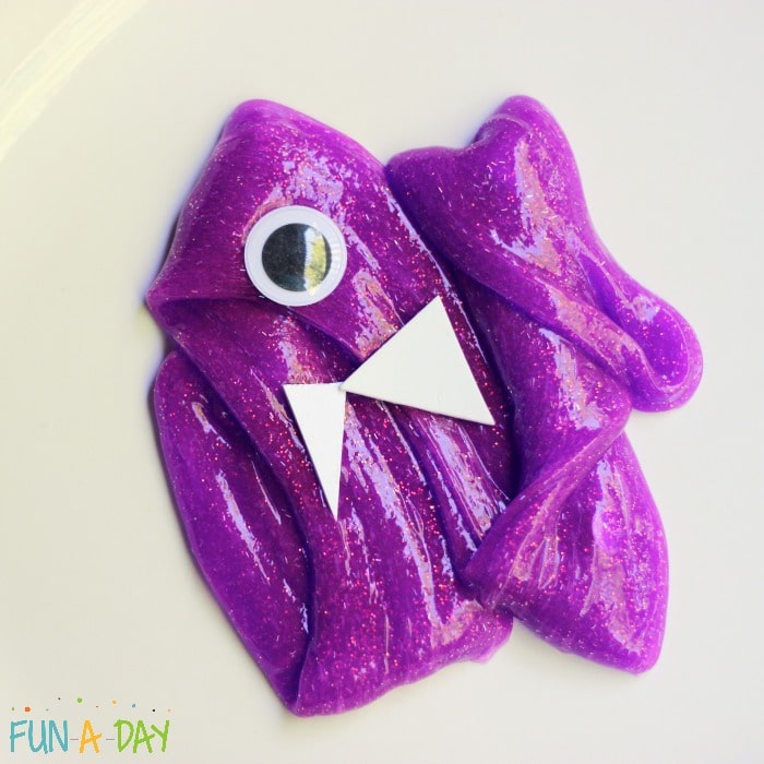 purple slime with a large googly eye and two foam triangle teeth