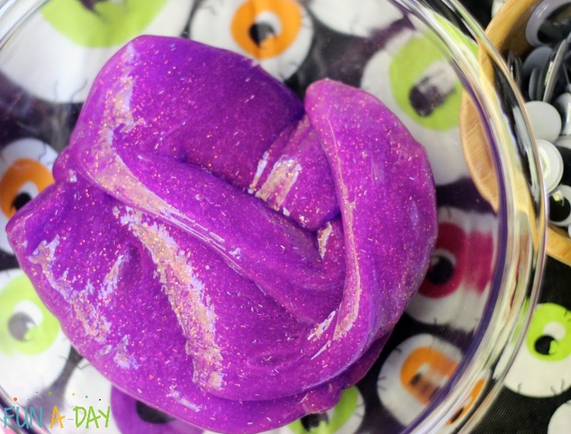 purple slime in a clear glass bowl