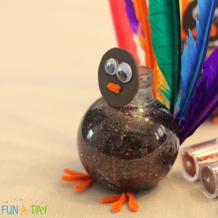 Turn a sensory bottle into a turkey for Thanksgiving fun with the kids