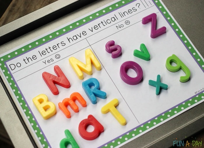 Free printable letter sorting mat that reads 'Do the letters have vertical lines?