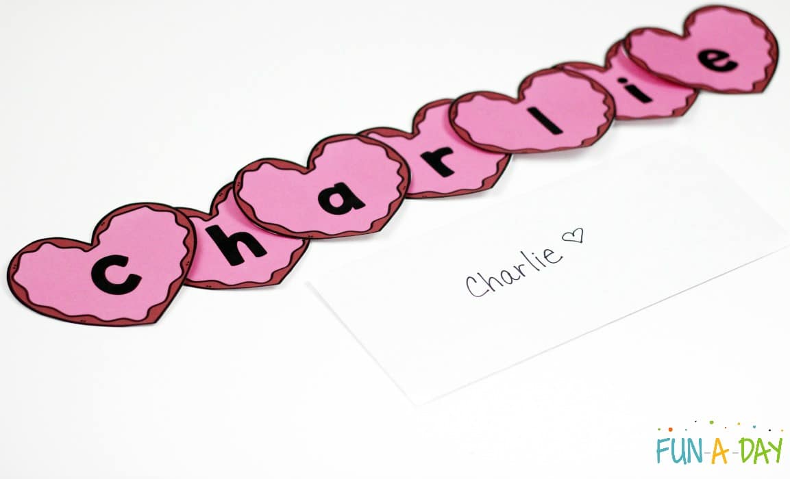 the name charlie spelled in heart letter cards