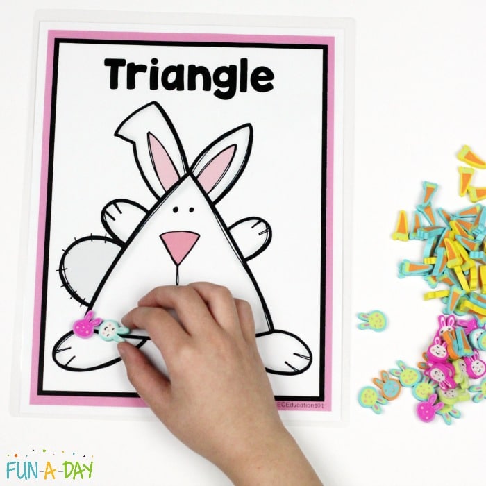 Placing mini erasers on the printable bunny shapes