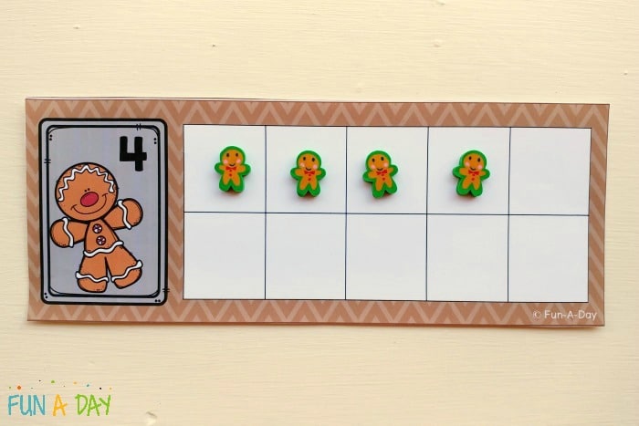 Gingerbread man printable ten frame with the number 4 and four mini erasers