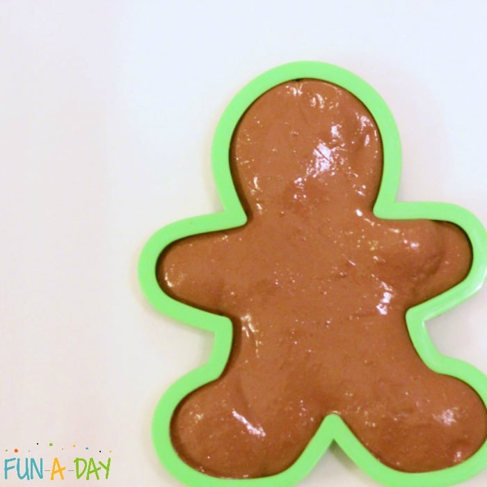 making gingerbread man out of butter slime with model magic