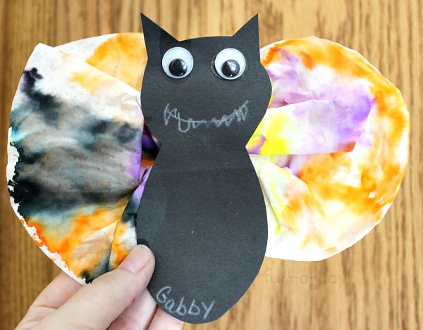 child made bat craft with coffee filter wings